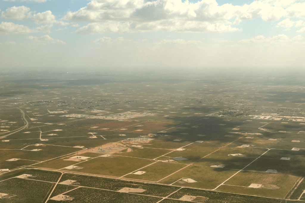 aerial view of oil fields in West Texas with clouds
