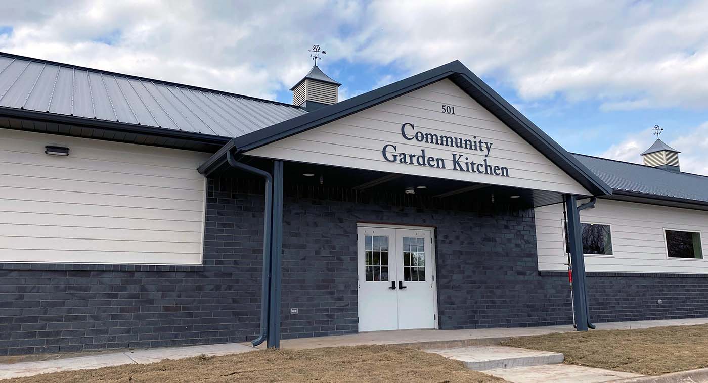 A brick building known as The Community Garden Kitchen run by Fairview, Texas resident