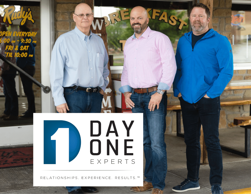 Jim Gandy, Super Dave Quinn, and Jason Adams standing in front of Rudy's Barbecue in Frisco Texas with a Day One Experts Logo